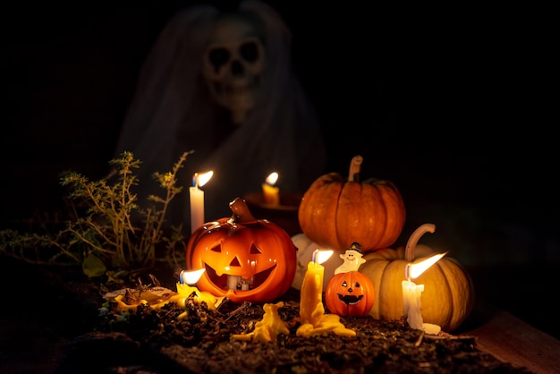 Halloween Pumpkins And Candles On Wooden