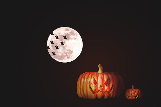 Halloween pumpkins at night under the full moon in the forest