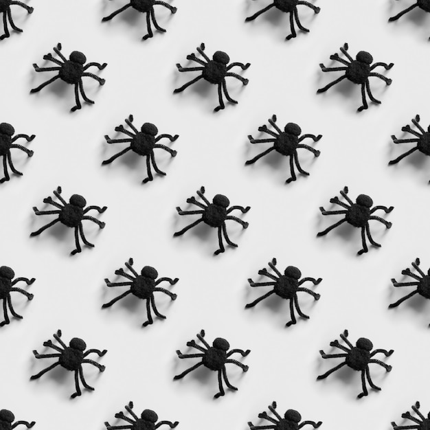 Halloween seamless pattern of many black spiders