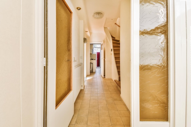 The hallway of a house with a hallway door open