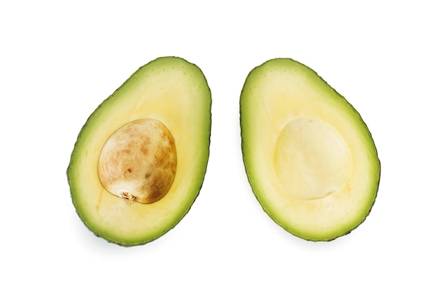 Halved avocado on a white background