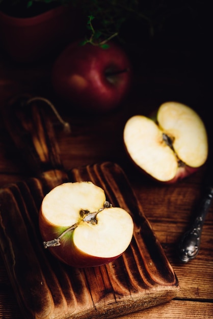 Halved Red Apple on Cutting Board