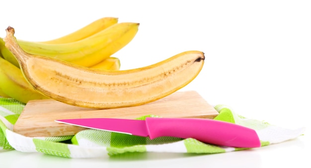 Halved and whole ripe bananas isolated on white