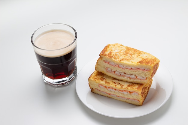 Ham crab sandwich and coffee on white background