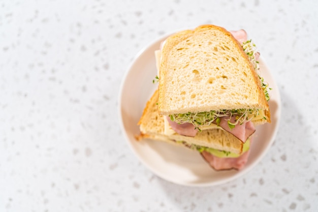 Ham cucumber and sprout sandwich