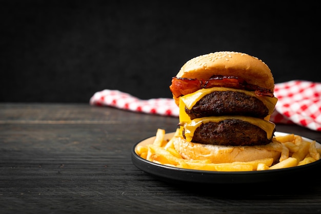 hamburger or beef burgers with cheese and bacon - unhealthy food style