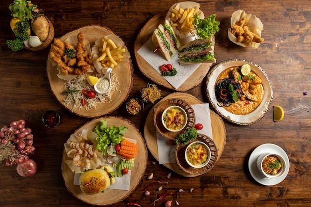 Hamburger french fries and cheese on wooden table