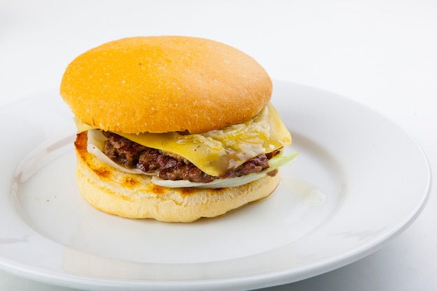 hamburger with cutlet on a plate and white plate