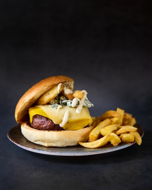 hamburger with french fries on chalkboard background