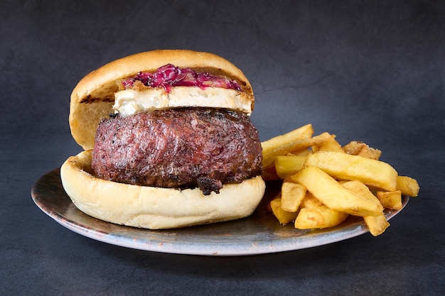 hamburger with french fries on chalkboard background