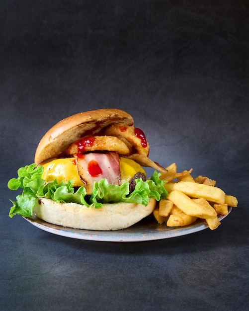 hamburger with french fries on chalkboard background