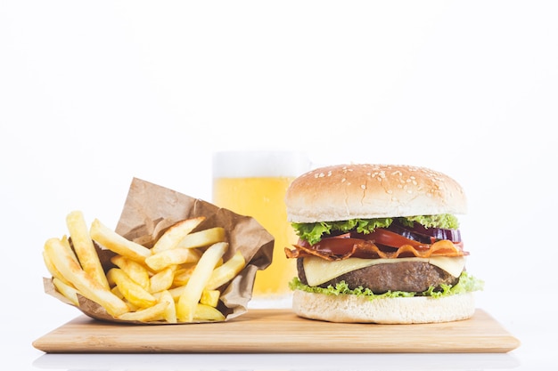 Hamburger with fries and beer, isolated on white