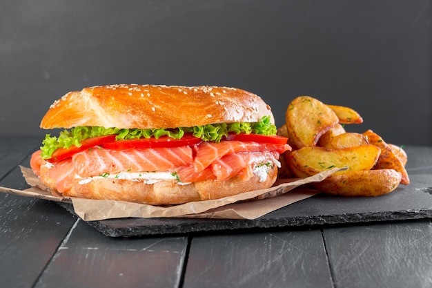 Hamburger with fries on a slate plate