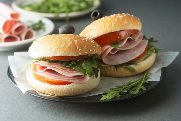 Hamburger with ham. Two burgers, hoemmade food. healthy sandwich with fresh vegetables.