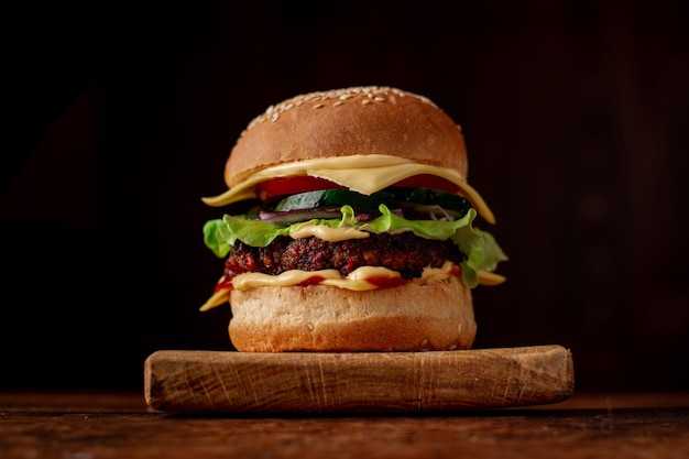 Hamburger with sesame seeds bun Wooden background Food concept Hamburger day