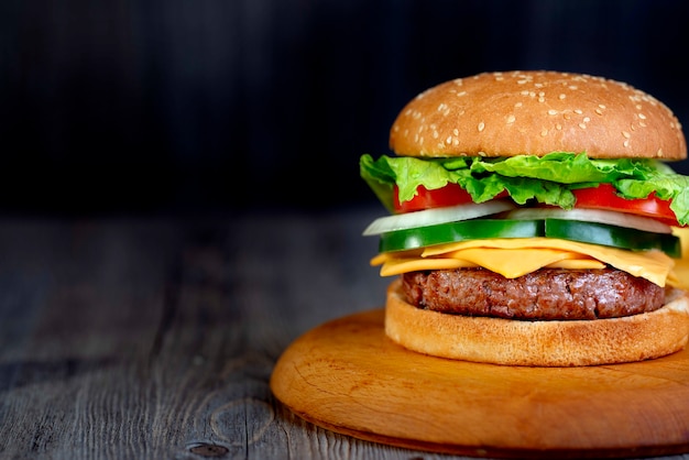 Hamburger on wooden plate