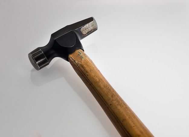 Hammer on white surface