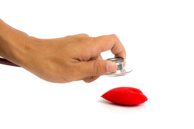 hand action red heart check by stethoscope on white background.