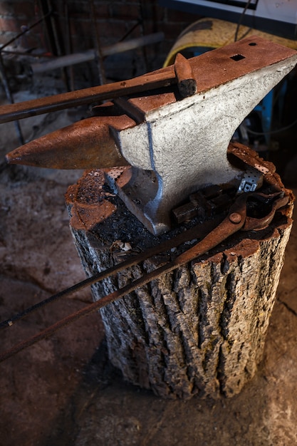 Hand anvil. Tools in old blacksmith shop.