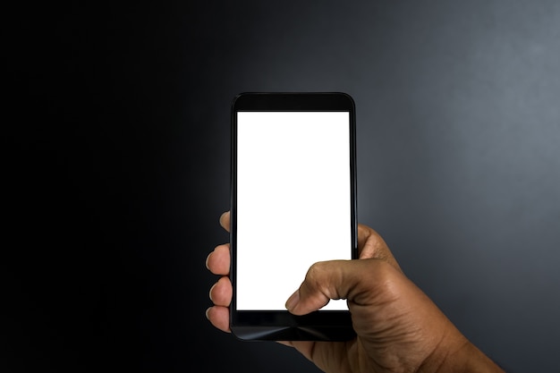 Hand of asian man holding smartphone on dark style