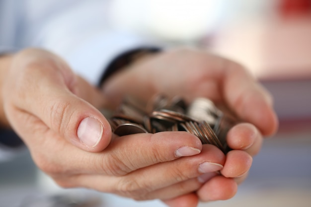 Hand businessman putting pin money