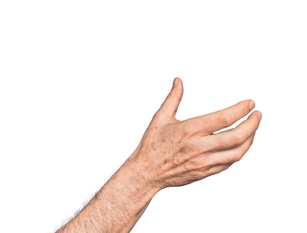 Photo hand of caucasian middle age man over isolated white background holding invisible object empty hand doing clipping and grabbing gesture