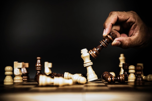 Hand choose king chess challenge fighting concepts of competition challenge of leader business team or teamwork volunteer or wining and leadership strategic plan and risk management or team player