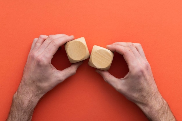 Hand choosing a wooden block from a set Business choice concept