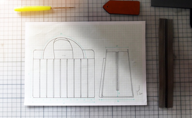 Hand craft bag disign concept sketch in paper and tools.