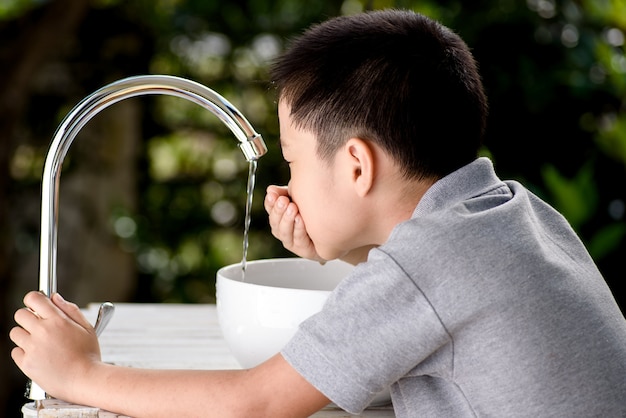 Hand and faucet