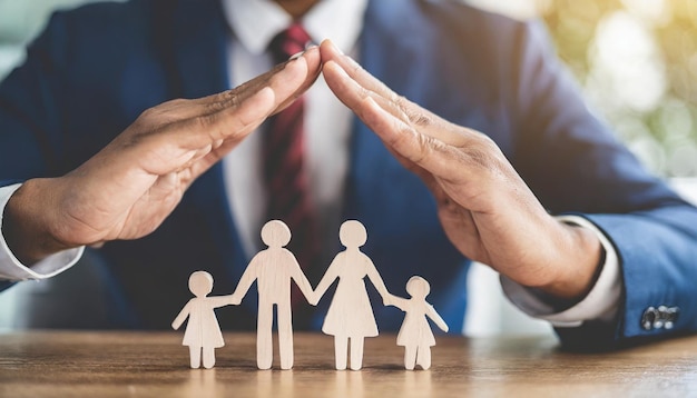 hand gesture shields wooden dominoes falling toward family dolls symbolizing protection insurance