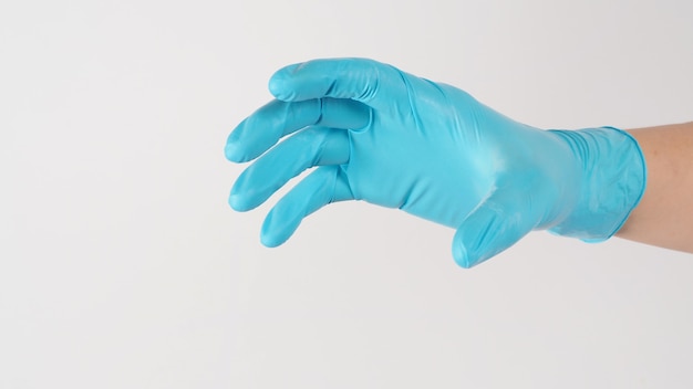 Hand do grab gesture and wear blue medical glove on white background.