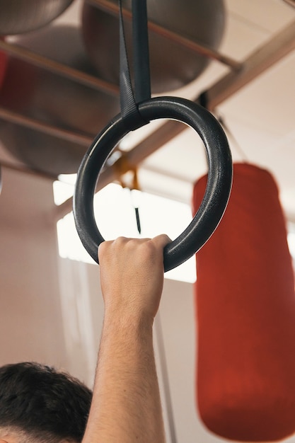 Hand grabbing a hoop to hang