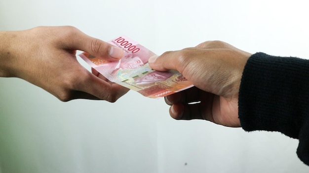 Hand hold money rupiahtransaction concept financial concept