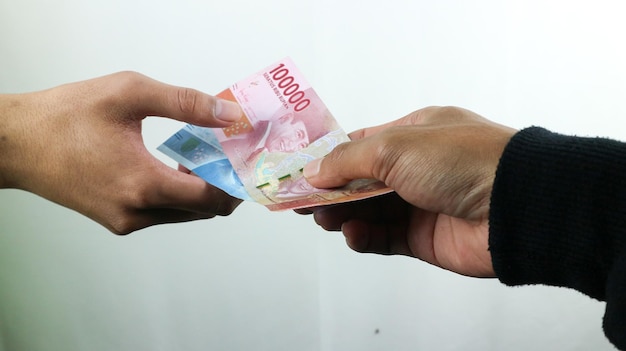 Hand hold money rupiahtransaction concept financial concept