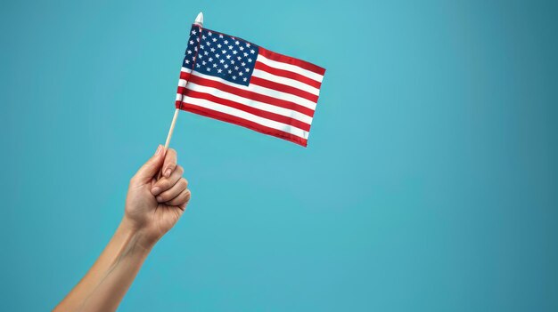 A hand holding an American flag