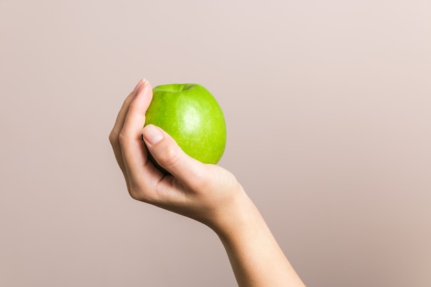 hand holding apple