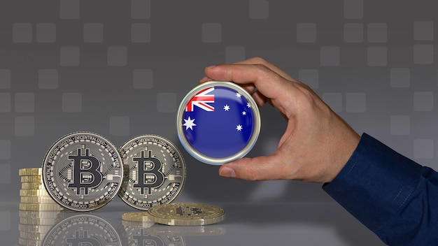 A hand holding a badge with the Australian flag in front of some bitcoins Crypto currency concept