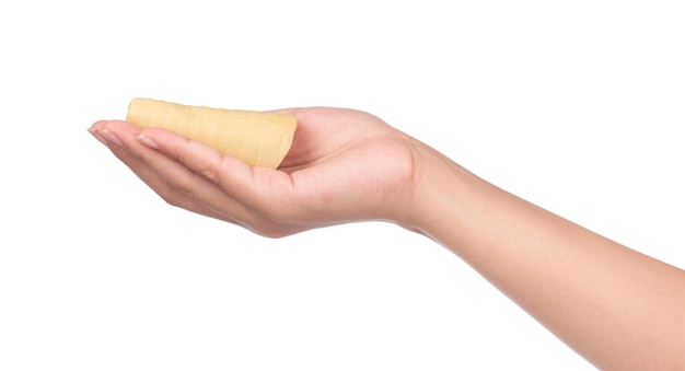 hand holding boiled bamboo shoots isolated on white background