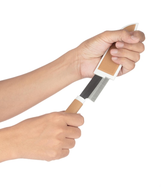 hand holding Brown knife with a brown knife sheath on a white background