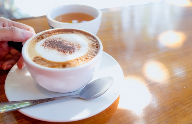 Hand holding coffee cup. Concept  morning drink.