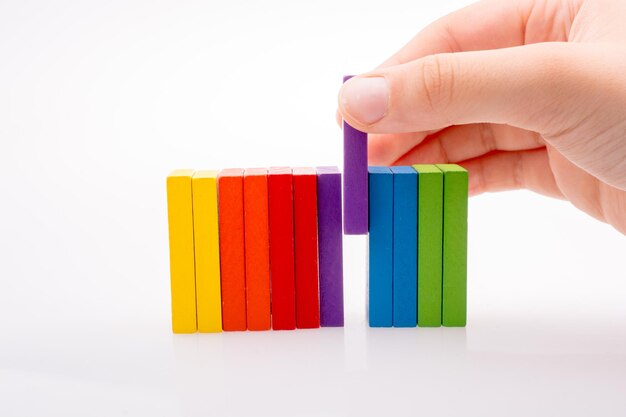 Hand holding color dominoes