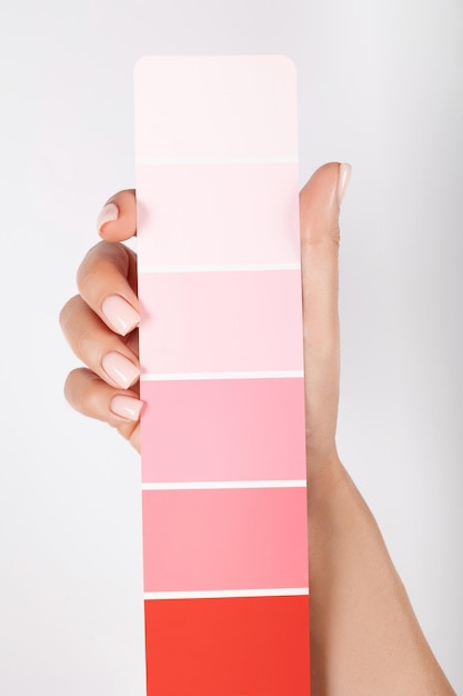 Hand holding Color samples palette design catalog