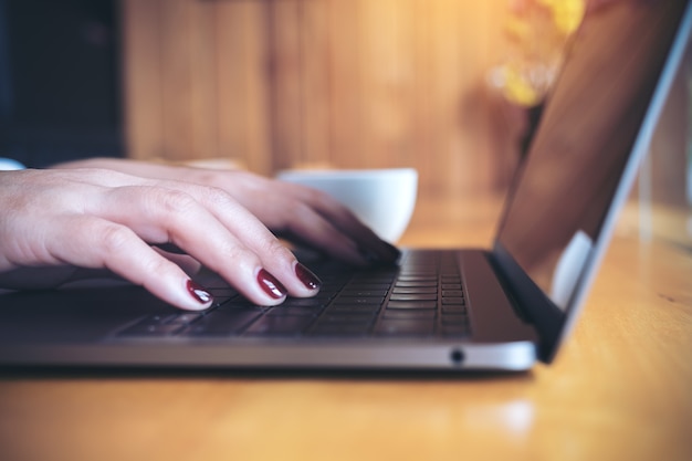 Hand holding computer laptop