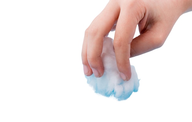 Hand holding cotton on white background