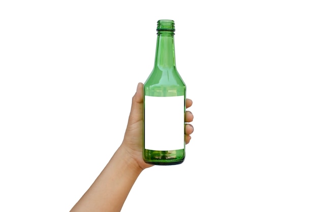 Hand holding an empty green glass bottle with a text space isolated on a white background with the clipping path.