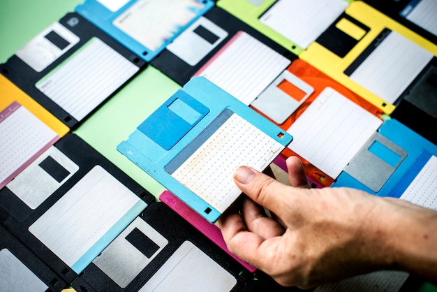 Hand holding floppy disk drive data storage