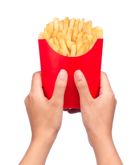 hand holding French fries in a red paper bag isolated on a white background