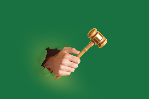 Hand holding gavel of judge