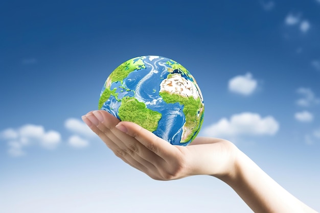 Hand holding green earth isolated on blue sky background mother earth day illustration